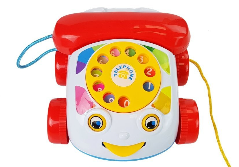 Dětský vlečný telefon na kolečkách se sluchátkem na baterie LEAN Toys s rozvojem manuálních schopností a rozlišování barev pro děti od 9 měsíců — V provozu